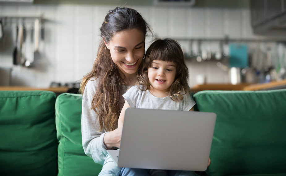 Mother and daughter looking at computer