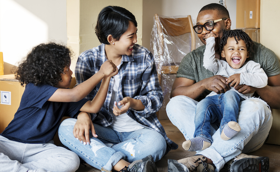 Family sitting in new home