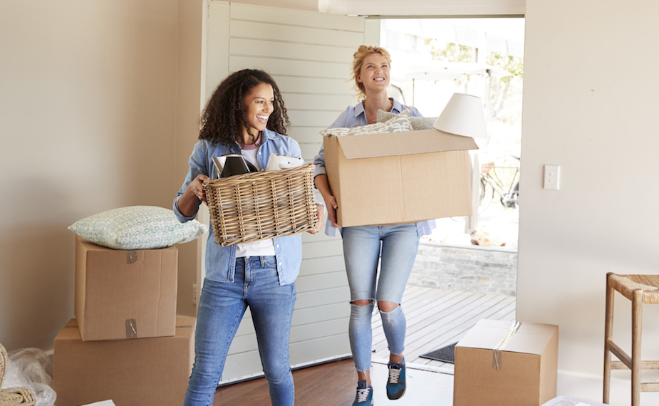 Women moving in to new apartment